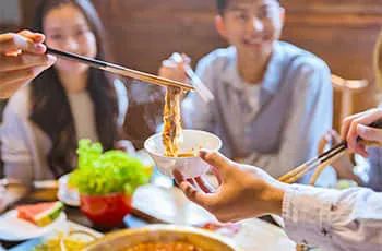 chinese eating with chopsticks