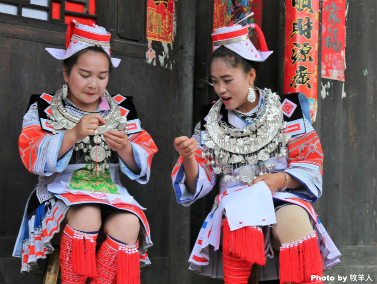 Two Gejia women embroidering